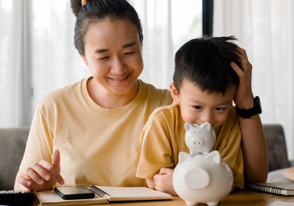 Mother and child planning family savings together